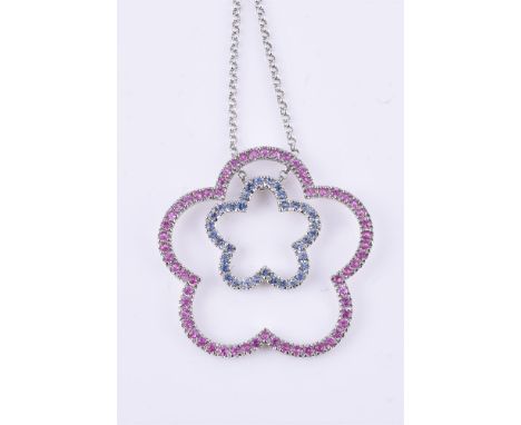 
	
		A blue and pink sapphire flower pendant, the two pierced flower heads set with circular cut pink sapphires or blue sapph