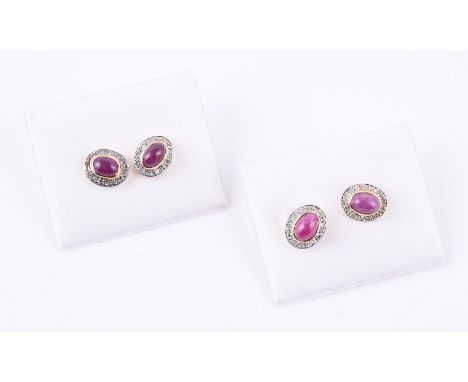 
	
		A pair of cabochon ruby and diamond point cluster earrings, 9mm long; together with a further similar pair; 2.5g gross

