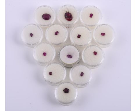 
	
		†&nbsp;A collection of unmounted red stones, including an oval synthetic ruby approximately 8.20 carats; together with v