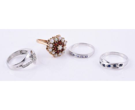 
	
		A 9 carat yellow gold opal and garnet cluster ring, finger size M, 4.5g gross; and three various diamond band rings, all