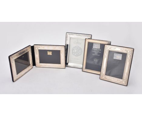 
	
		Four silver mounted photo frames, to include; a rectangular photo frame by Carr's of Sheffield Ltd., Edinburgh 2002, wit