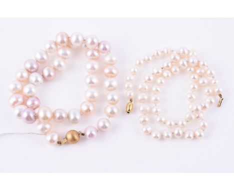 
	
		Two freshwater pearl necklaces, the first with ovoid freshwater pearls measuring approximately 1cm to 1.2cm long, the cl