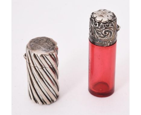 
	
		A Victorian silver cylindrical scent bottle by Sampson Morden, London 1883, with wrythen decoration, engraved with a mon
