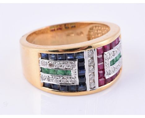 
	
		A sapphire, ruby, emerald and diamond dress ring, the broad band channel set with step cut sapphires, rubies and emerald