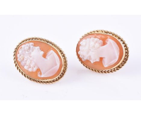 
	
		A pair of shell cameo earrings, the oval panels carved with the profile of a lady, stamped 585 with Italian control mark