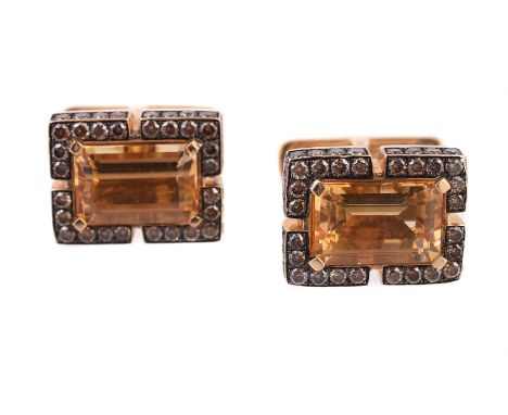 
	
		A pair of brown diamond and citrine cufflinks by Ashley, the step cut citrines within a surround of brilliant cut brown 