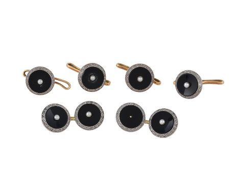 
	
		A pair of 1930s onyx and seed pearl cufflinks, the cufflinks with circular onyx panels each with a central seed pearl ac