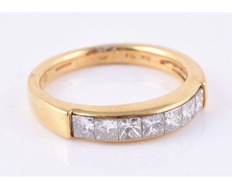 
	
		A seven stone diamond ring, set with seven princess cut diamonds, approximately 1.05 carats total, 18 carat gold hallmar