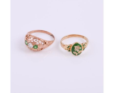 
	
		A diamond and tsavorite garnet dress ring, the pierced scrolled setting with a central old cut diamond, approximately 0.