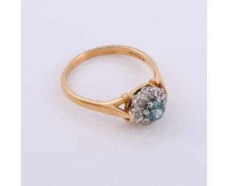 
	
		A blue zircon and diamond cluster ring, the circular cut blue zircon within a surround of eight cut diamonds in illusion