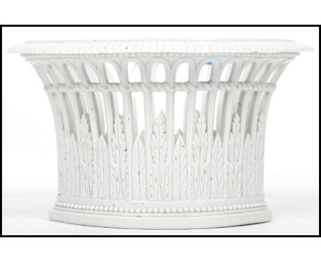 A Meissen cream basalt porcelain planter vase having pierced sides with ribbed edge and blue cross swords mark to base. Measu