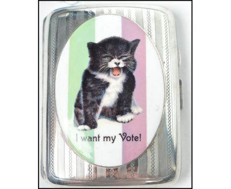 A good silver cigarette case with an enamel plaque of a cat in the suffragette manner bearing notation ' I want my vote ' Ple