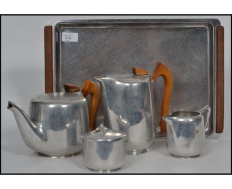 A Picquot Ware stainless steel five part tea service, comprising of teapot, water jug, milk jug, sugar bowl and serving tray.