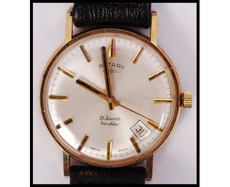 A 9ct gold hallmarked Rotary 21 jewels incabloc swiss movement with baton numerals and angled date aperture. Set to a black l