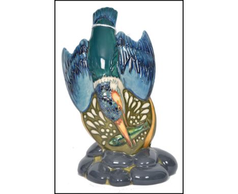 A fantastic Moorcroft trial piece ceramic figurine display modelled as diving kingfisher with fish in beak raised on a natura