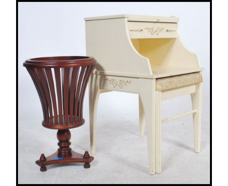 A louis 16th style bedside table raised on sabre legs with drawers and raised tier above together with a mahogany planter of 