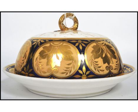 An early 19th century Regency period English ceramic muffin dish, possibly by Coalport, decorated with applied gilt decoratio