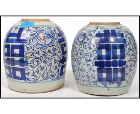 A pair of Chinese bulbous squat bodied blue and white ceramic ginger jars of larger proportions. Measurements: 20 cm high, 20