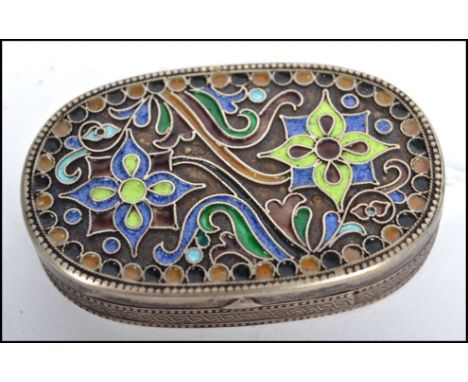 A possible Russian enamel and silver white metal snuff  / pill pot, fitted with a hinged enamel decorated lid, stylised borde