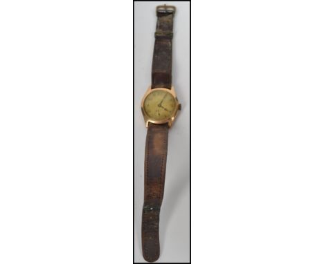 A gents vintage 20th century 9ct gold Swiss movement wrist watch, the enamel face having a seconds subsidiary dial,  Glasgow 