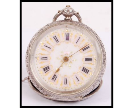 An early 20th century continental 825 silver marked ladies open faced pocket fob watch. Rococo chase case with gilt worked en