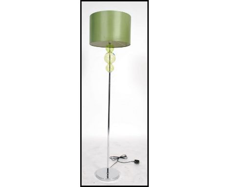 A 20th century / contemporary retro style chrome standard lamp with cylindrical green shade with green glass bubble form to t