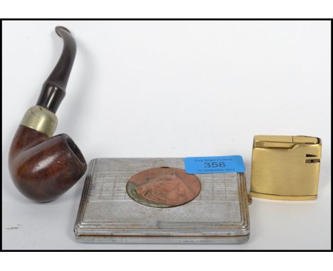 A vintage white metal cigarette case having a central horse head medallion together with a vintage Peterson tobacco pipe and 