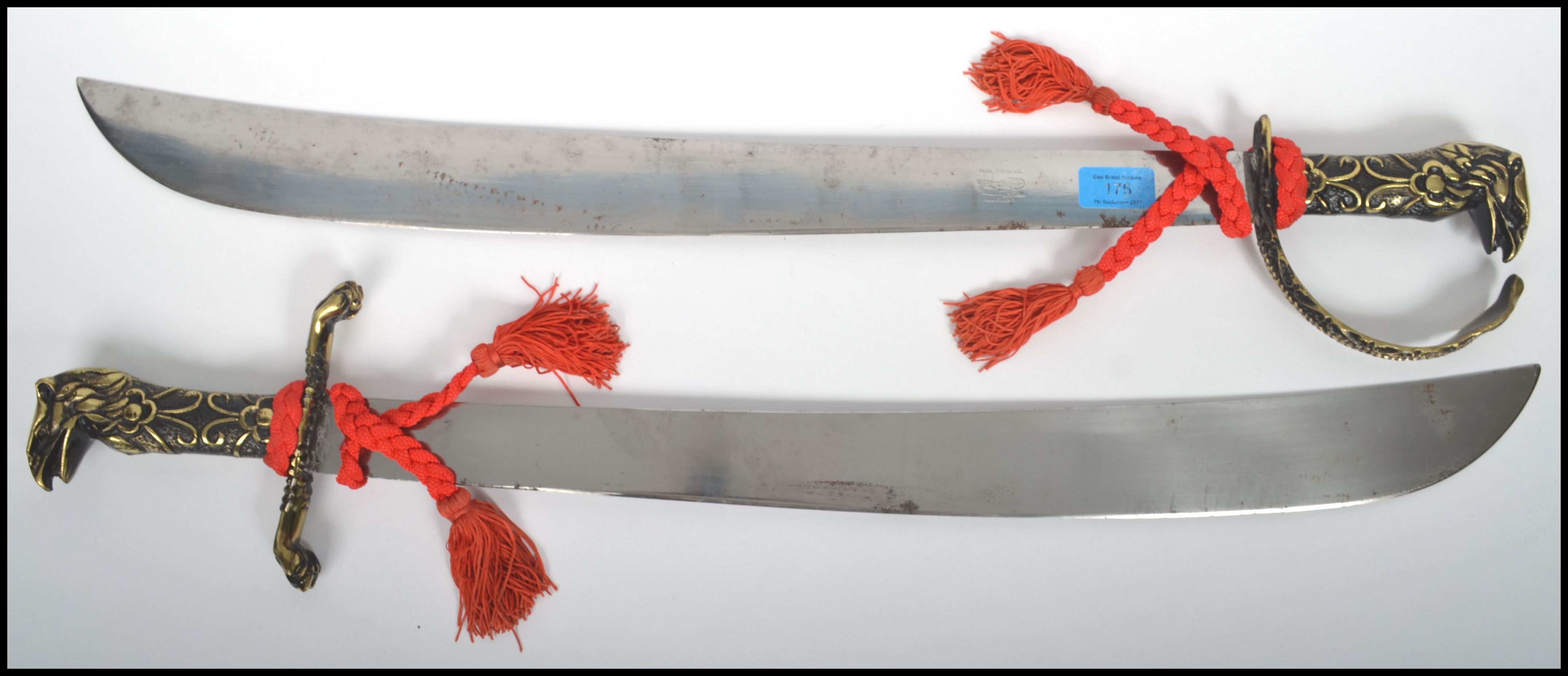 A pair of decorative large cutlass swords with polished stainless steel ...