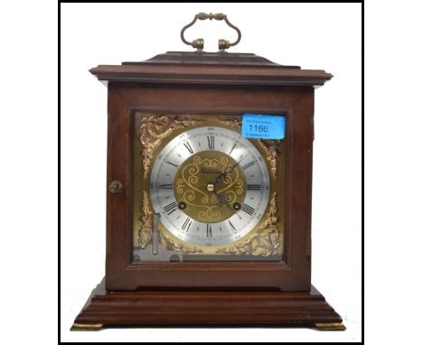 A vintage 20th century Metamec wooden cased mantle clock having a gilt back plate and spandrels, faceted hands and a roman nu