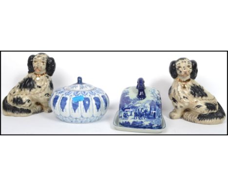 A group of 19th century ceramics to include a pair of Staffordshire fire side dogs, an Ironstone blue and white ceramic chees