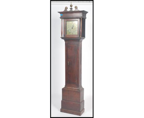 An 18th century oak brass faced longcase clock by Daniel Dalton of Church Lawford. The hood with columns and swan neck pedime