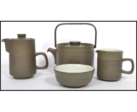 A vintage 1960's stoneware Denby teapot together with the matching creamer and sugar bowl. Measurements: 20 cm high, 21 cm wi