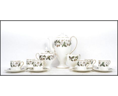 A vintage 20th century Wedgwood ceramic coffee service decorated in the Strawberry Hill pattern consisting of a tall coffee p
