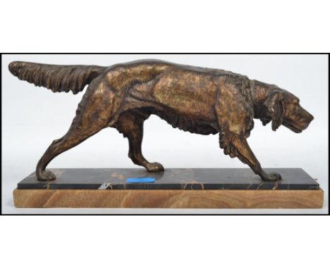 C. Masson: A 20th century bronze figurine of a retriever dog raised on a stepped two tone marble base with C. Masson (Clovis 