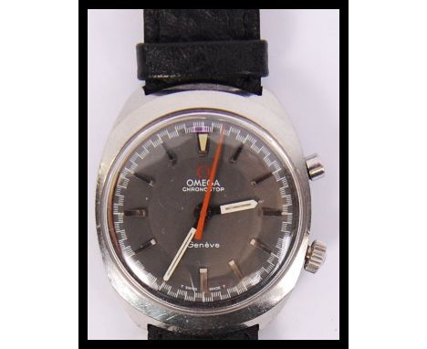 A vintage Omega Geneve chronometer Chronostop wristwath having a black dial with luminous hands and red sweeper seconds hand.