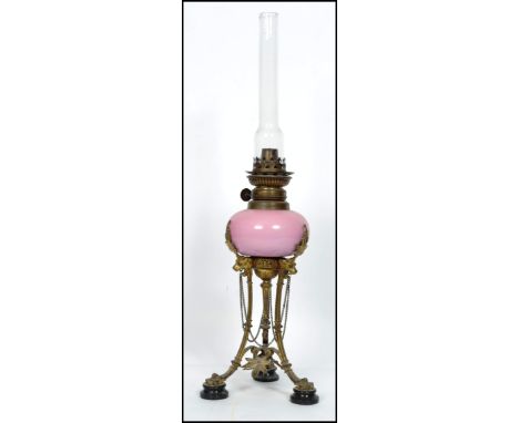 A good Zimmerman & CO Patent Victorian oil lamp of neo classical Adams  revival form having hairy paw feet with tripod base a
