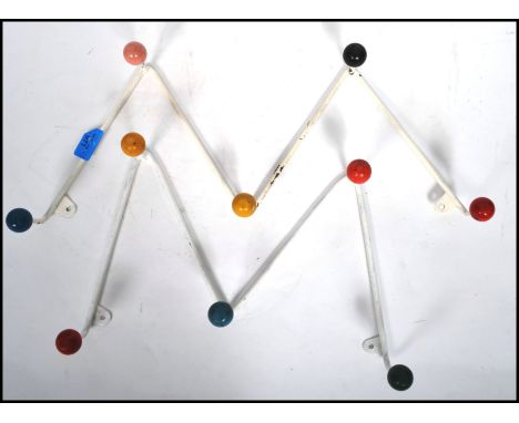 A pair of retro 1950's atomic / sputnik style wall mounted coat racks with colourful finial ends 