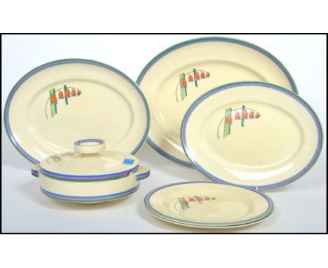 A group of early 20th century Clarice Cliff ceramics in the ' Solomon Bells  ' pattern consisting of plates tureens etc pleas