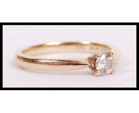 A 9ct gold and diamond ring having single solitaire stone being claw mounted. The diamond approx 25pnts. Total weight 2.4g / 