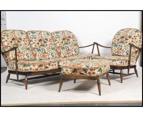 A vintage retro 20th century Ercol Windsor three seater settee / sofa, together with a matching armchair and footstool. 