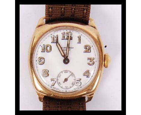 A good early 20th century 9ct gold JW Benson of London gents wristwatch having Art Deco faceted hands and dial with subsidiar
