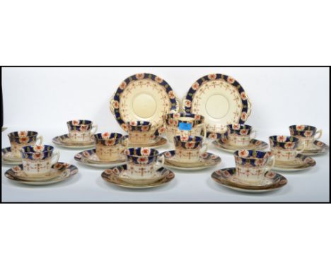 A 20th century 12 person ceramic tea  / dinner service by Stanley China to include cups, saucers, dinner plates etc. Stamped 