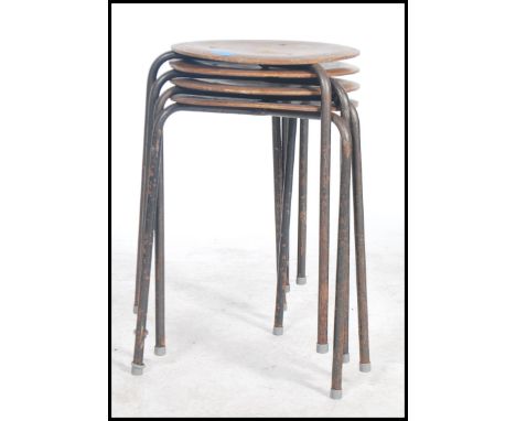 A set of four vintage retro 20th century dot stools in the manner of Arne Jacobsen for Fritz Hansen. The stools having a teak