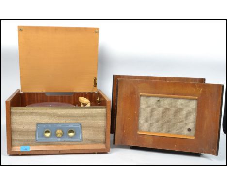 A vintage mid 20th century portable wooden cased four speed record player Pye, speaker to front together with a pair of plug 