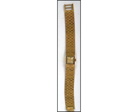 A vintage 1970s retro Rotary 21 jewel ladies watch of square form having baton numerals with faceted hands and a bark effect 