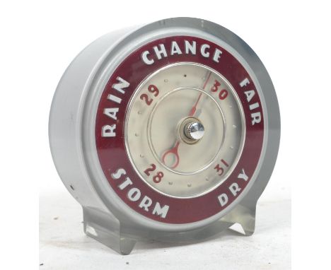 A vintage 20th century Joseph Lucas table barometer of circular car light form, marked to verso for Joseph Lucas. Measures 11