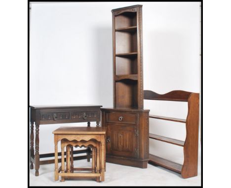A collection of 20th century reproduction oak furniture by Jaycee, to include corner unit, console, nest of tables together w