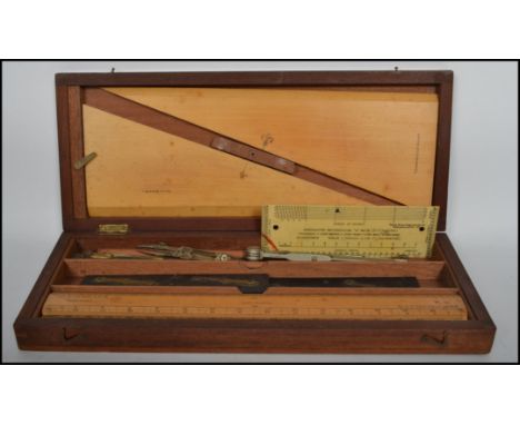 A late 19th century cased draughtsman's / mathematics set  containing different tools to include set squares with makers mark