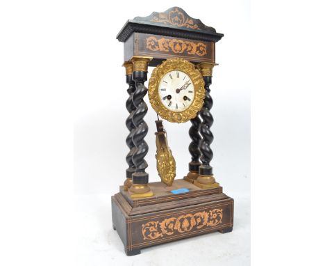 A French ormolu mounted ebonised portico mantel clock, 19th century, the silvered dial enclosing a two train movement with co