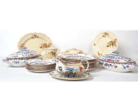A vintage 20th century Booths ceramic floral pattern dinner service along with a parrot ware dinner service. Please see image